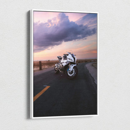 Vertical canvas wall art featuring a white BMW S1000RR motorcycle on a sunset road background.