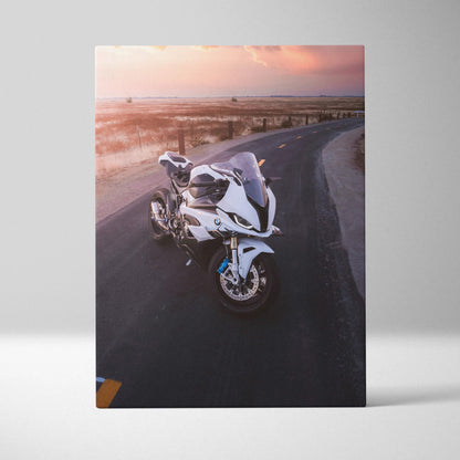 BMW S1000RR motorcycle on winding road at sunset printed on vertical canvas wall art.