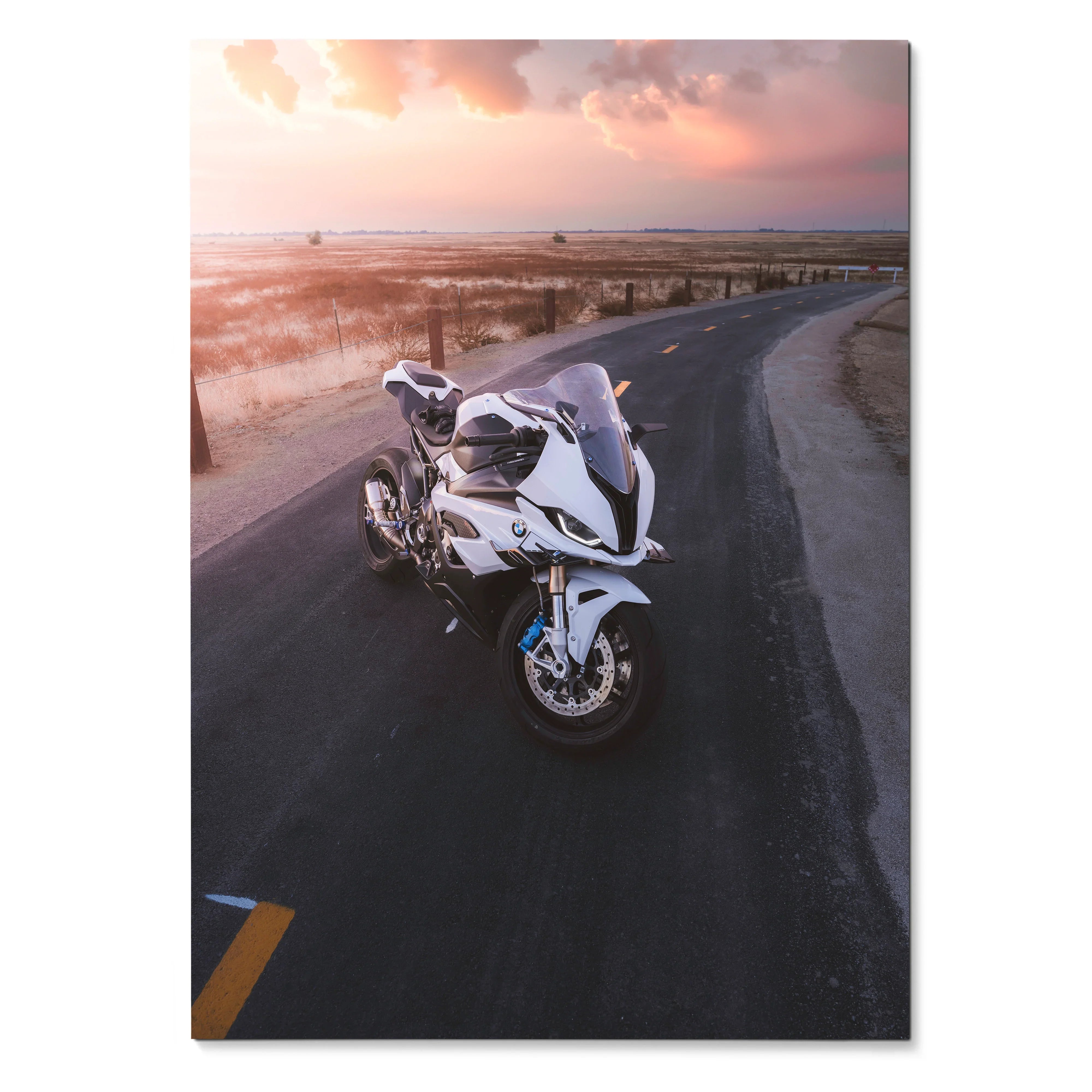 BMW S1000RR motorcycle on coastal road at sunset, poster wall art with vibrant sky colors.