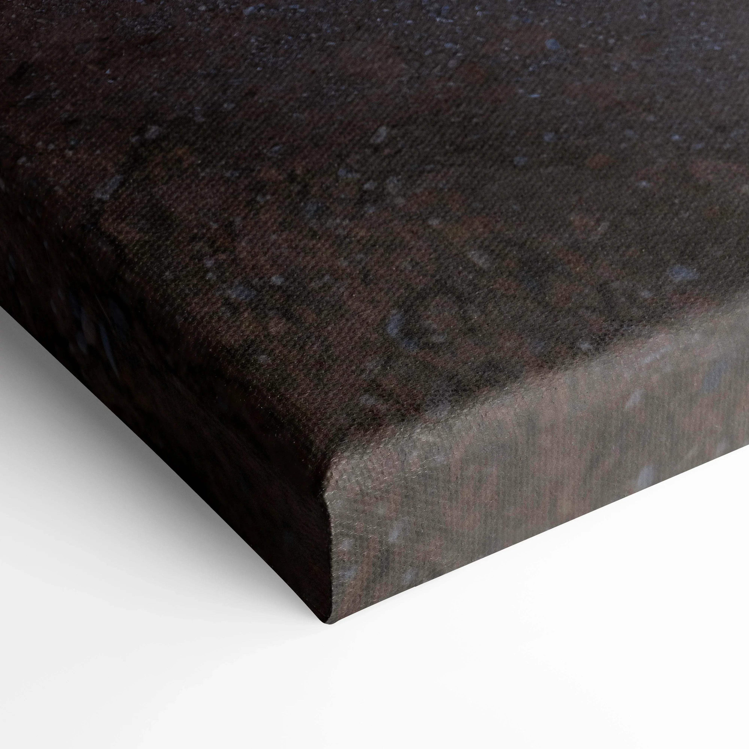 Close-up of textured dark brown canvas art wrap on vertical wall art print corner.
