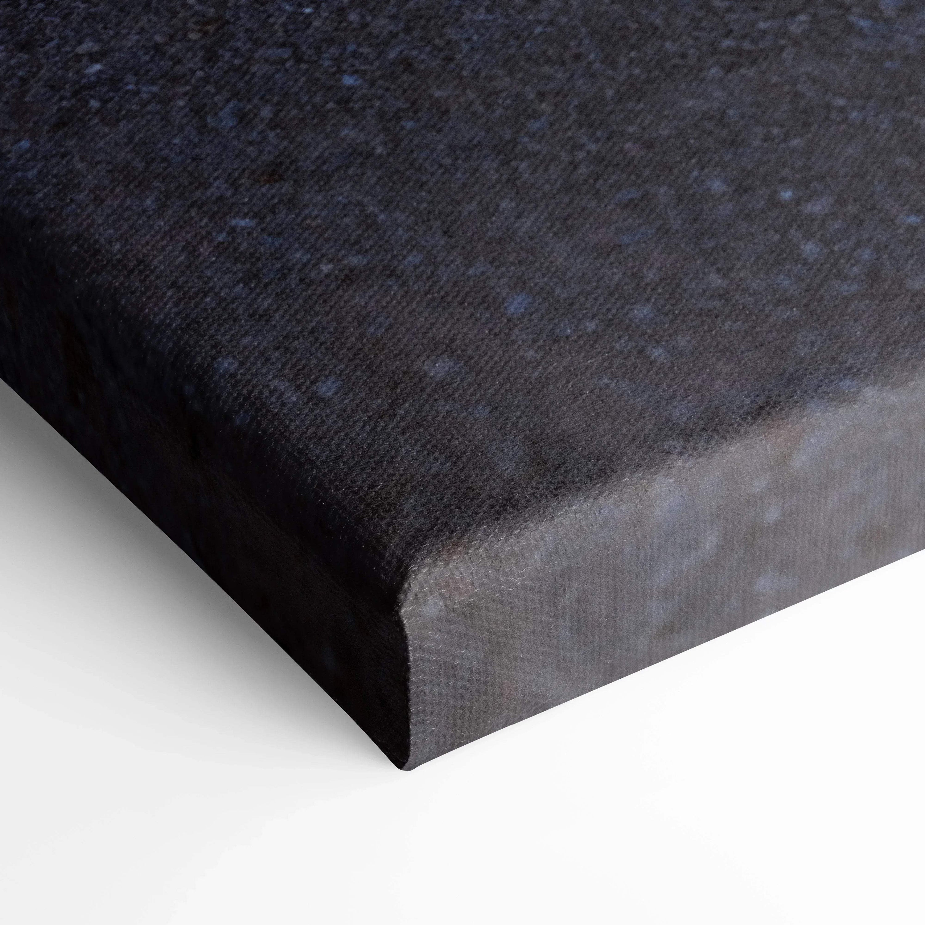 Close-up of textured black canvas corner with tight edge wrapping, museum-quality wall art detail.
