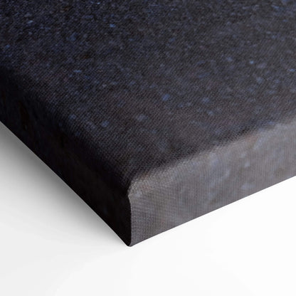 Close-up of textured black canvas corner with tight edge wrapping, museum-quality wall art detail.