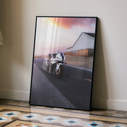 BMW S1000RR motorcycle poster leaning against wall with sunset and modern building background wall art.