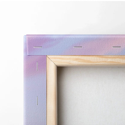 Close-up of wooden stretcher bars and staples securing blank white canvas for wall art or canvas art.