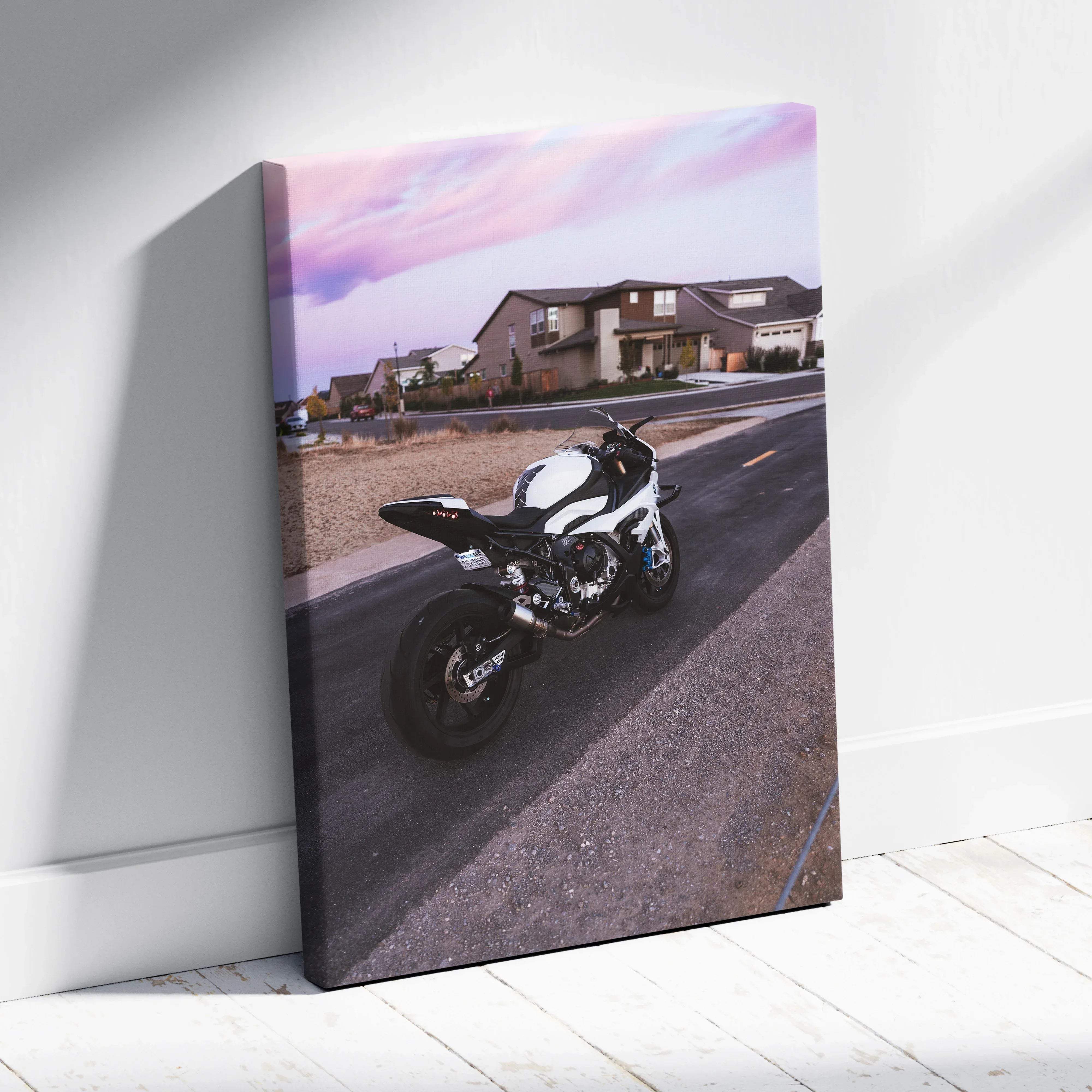 Canvas wall art featuring a white and black bmw inspired s1000rr sport motorcycle in an urban sunset mood