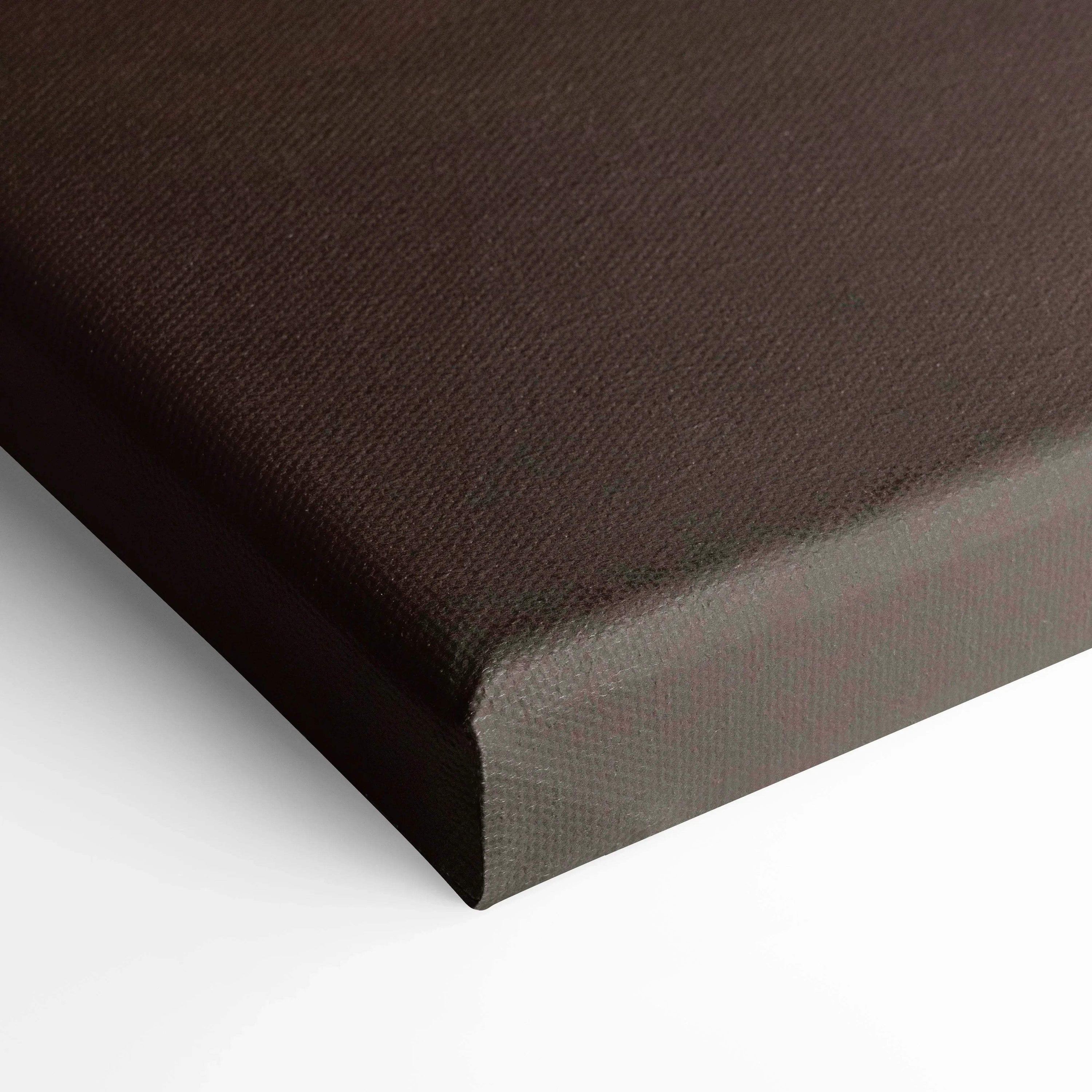 Close-up of textured black canvas corner on vertical wall art print.