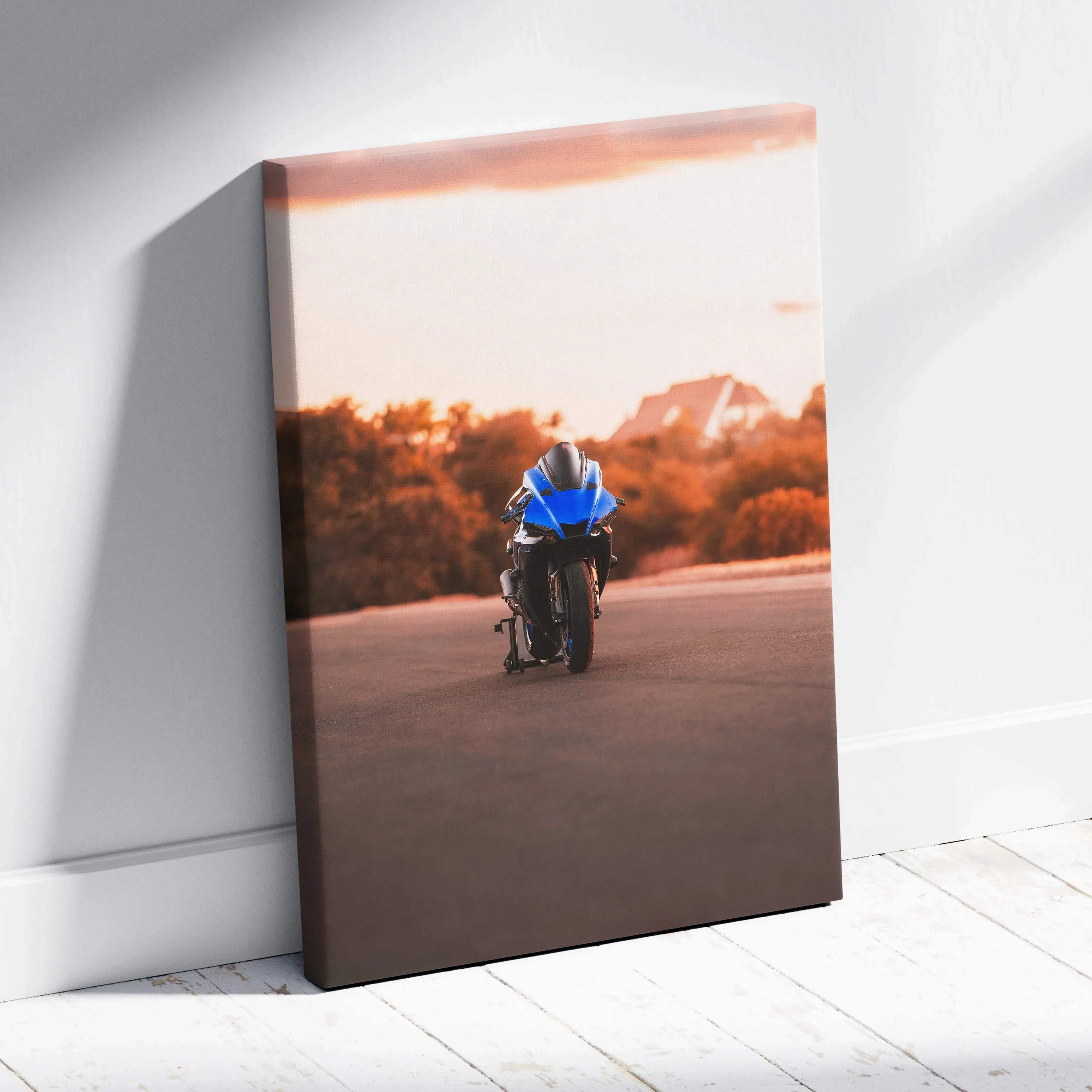 Yamaha R1 motorcycle at sunset canvas wall art with warm orange sky background.