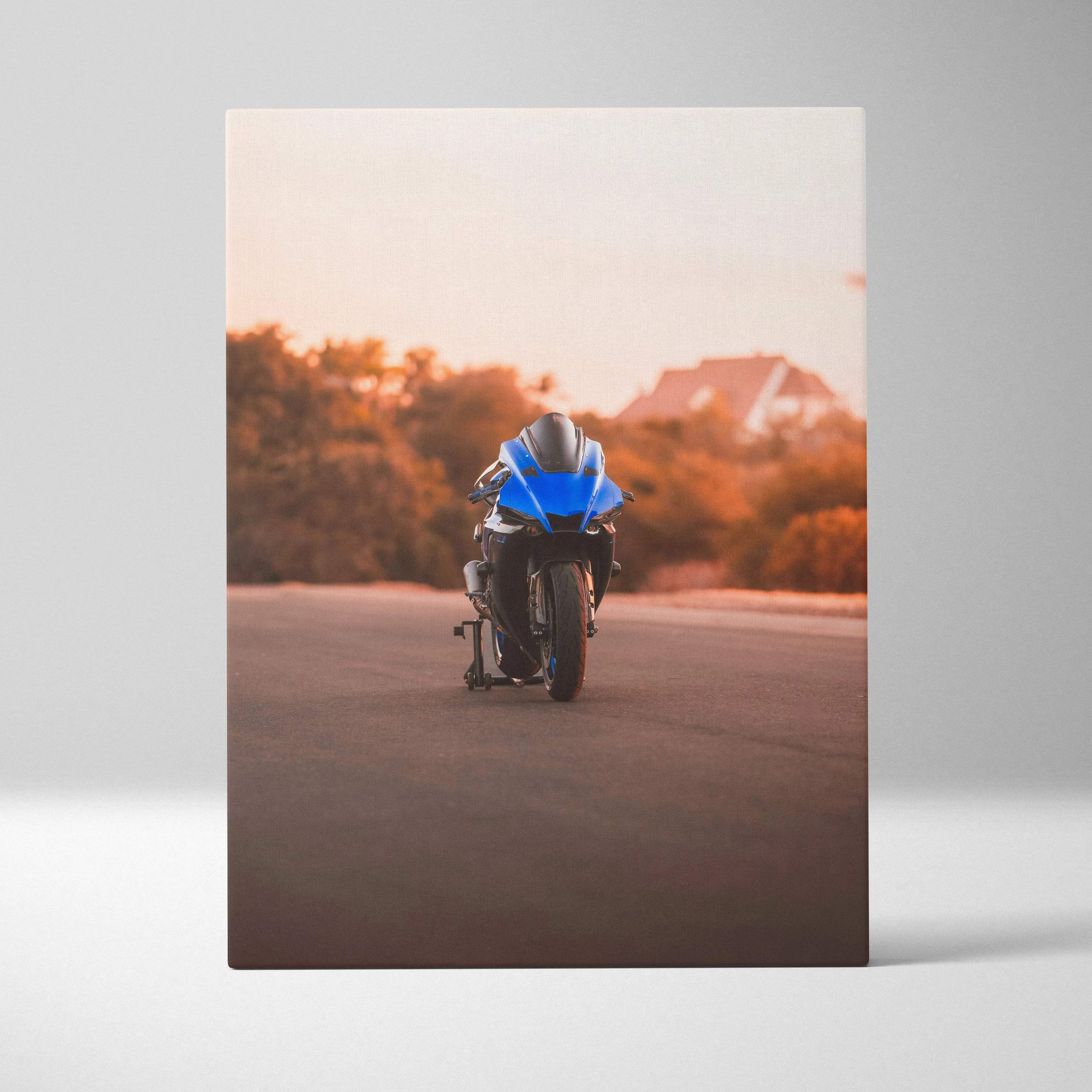 Blue Yamaha R1 motorcycle on road at sunset canvas wall art vertical print.