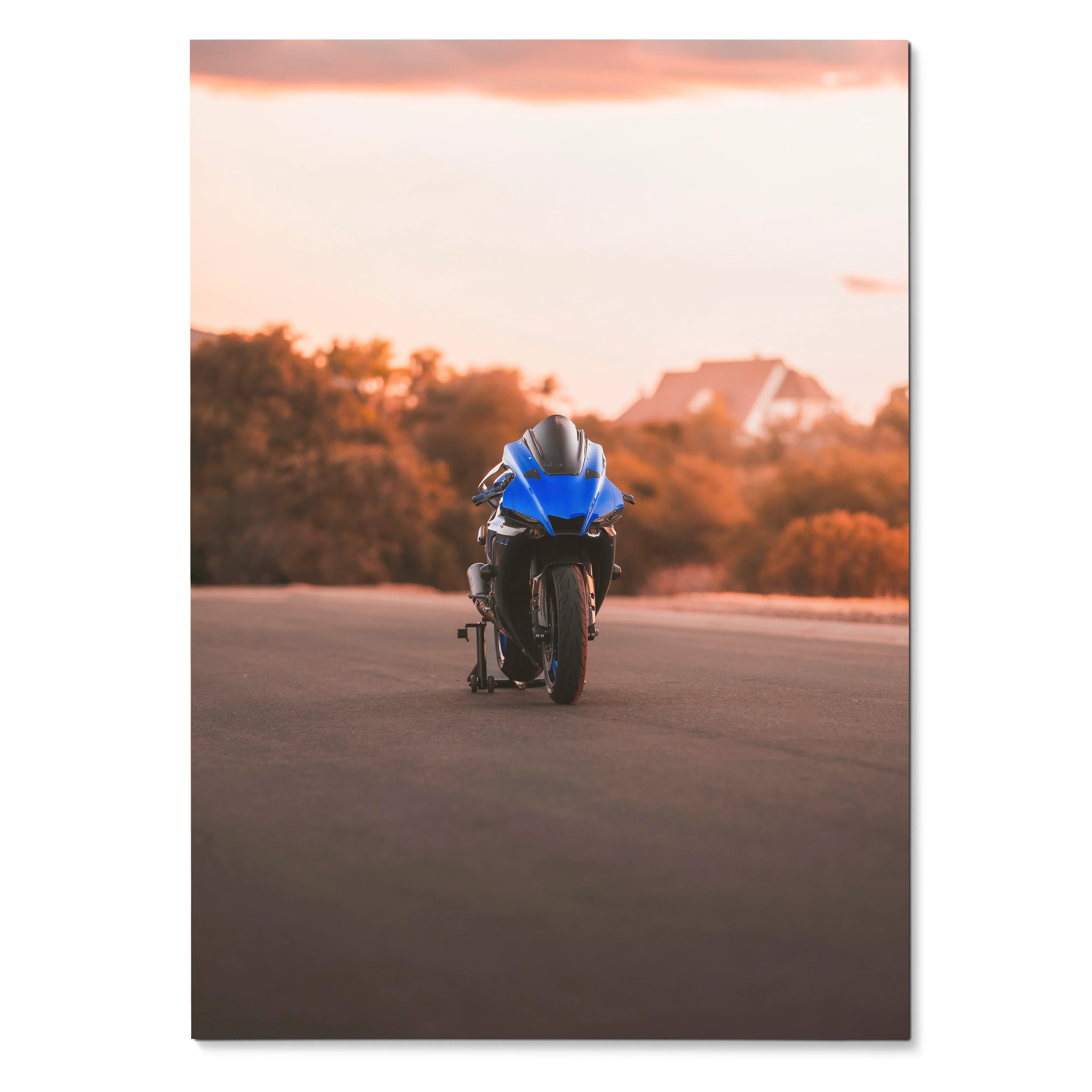 Yamaha R1 motorcycle on road at sunset poster wall art with warm soft background colors.