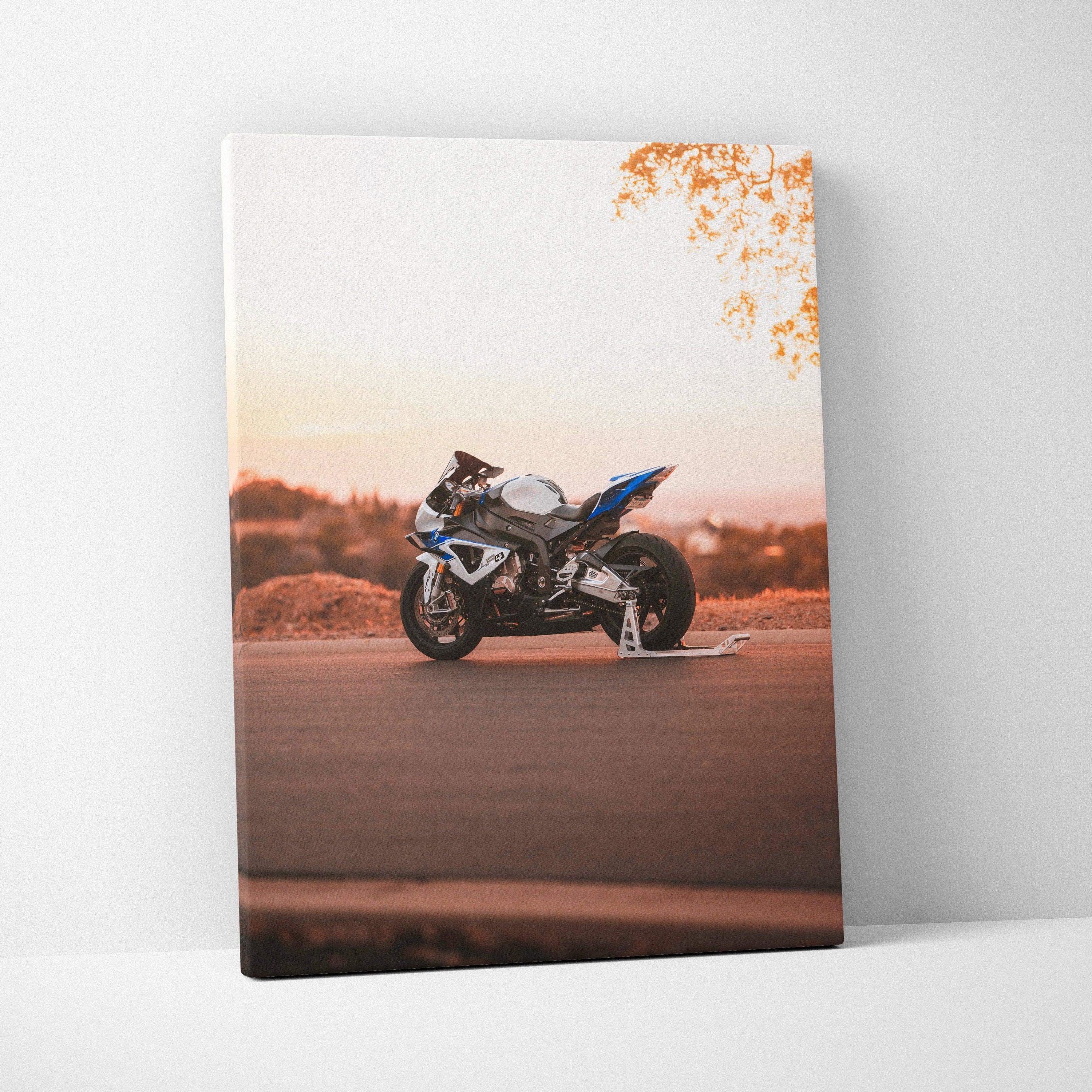 BMW S1000RR motorcycle at sunset on vertical canvas wall art with warm orange tones.