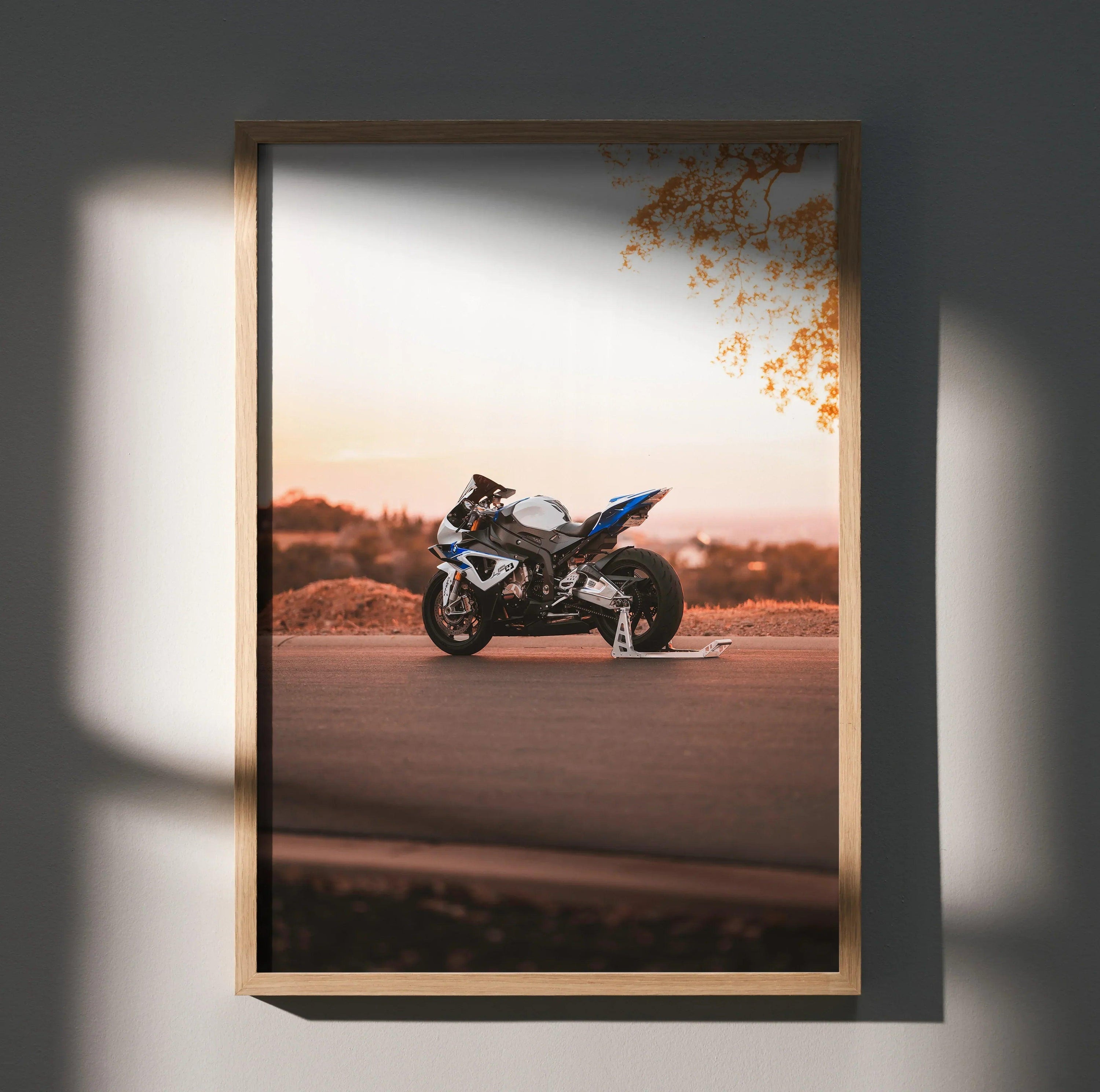 BMW S1000RR HP4 motorcycle poster wall art with sunset and scenic background.