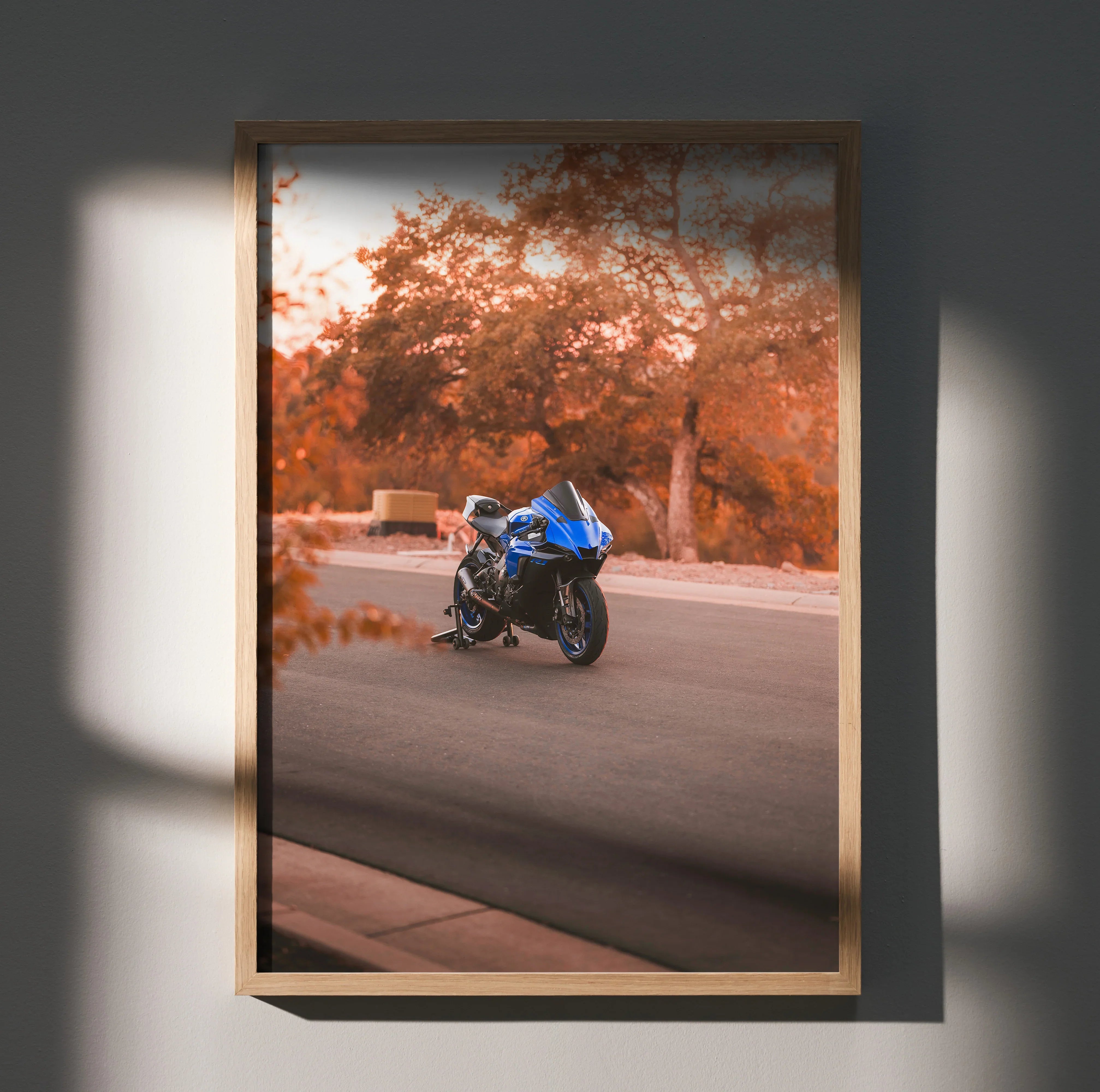 Yamaha YZF-R1 motorcycle poster on wall with autumn trees, blue sportbike, and road background wall art.