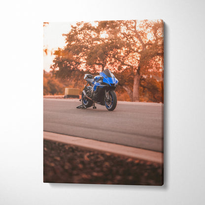 Yamaha R1 motorcycle on road at sunset canvas wall art with warm autumn tones.
