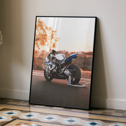 BMW S1000RR HP4 motorcycle poster with dynamic sunset road scene wall art in black frame.