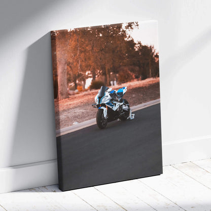 Vertical canvas art of BMW S1000RR motorcycle on road with autumn trees, modern wall art.