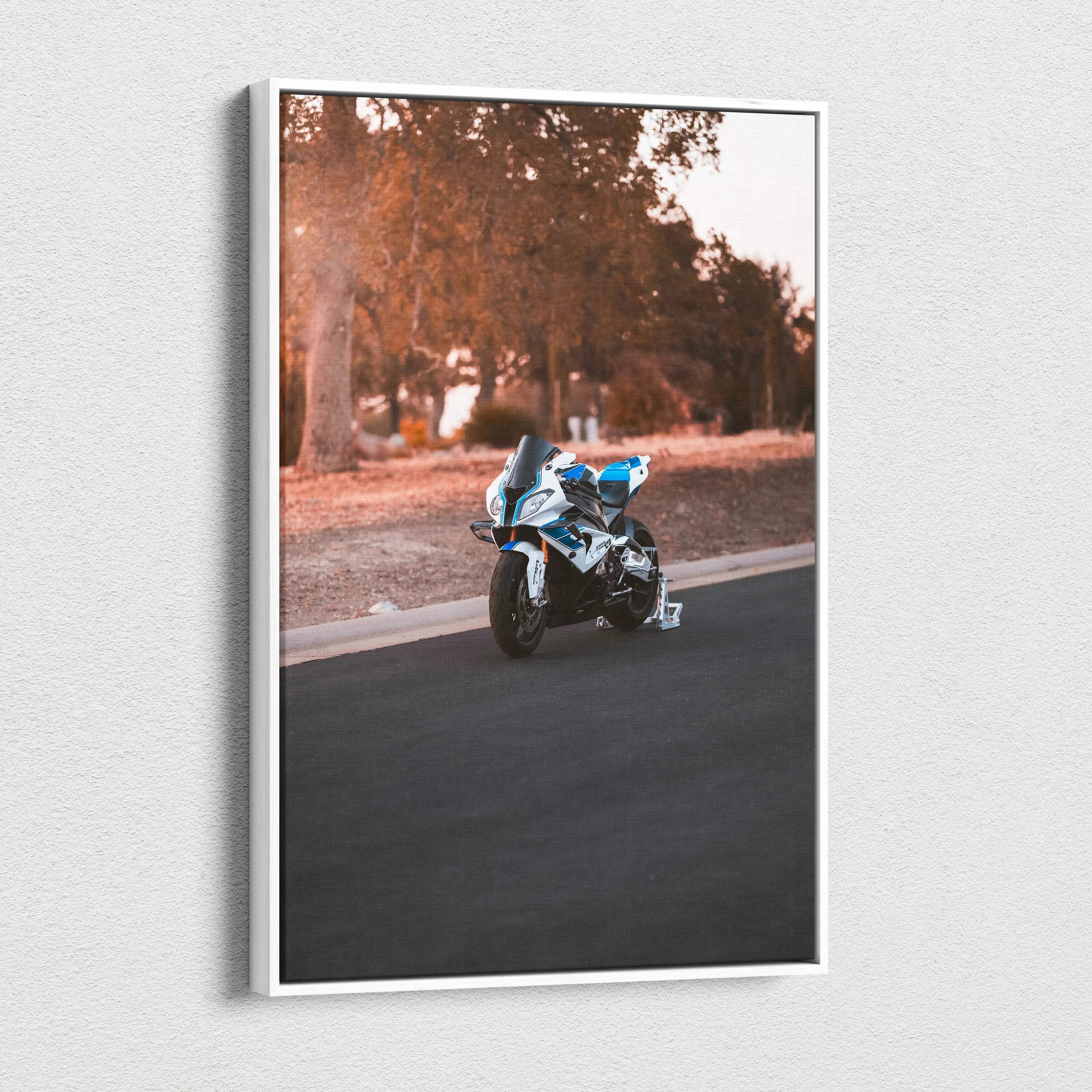Vertical canvas wall art featuring a BMW S1000RR motorcycle on a scenic road with autumn trees background.