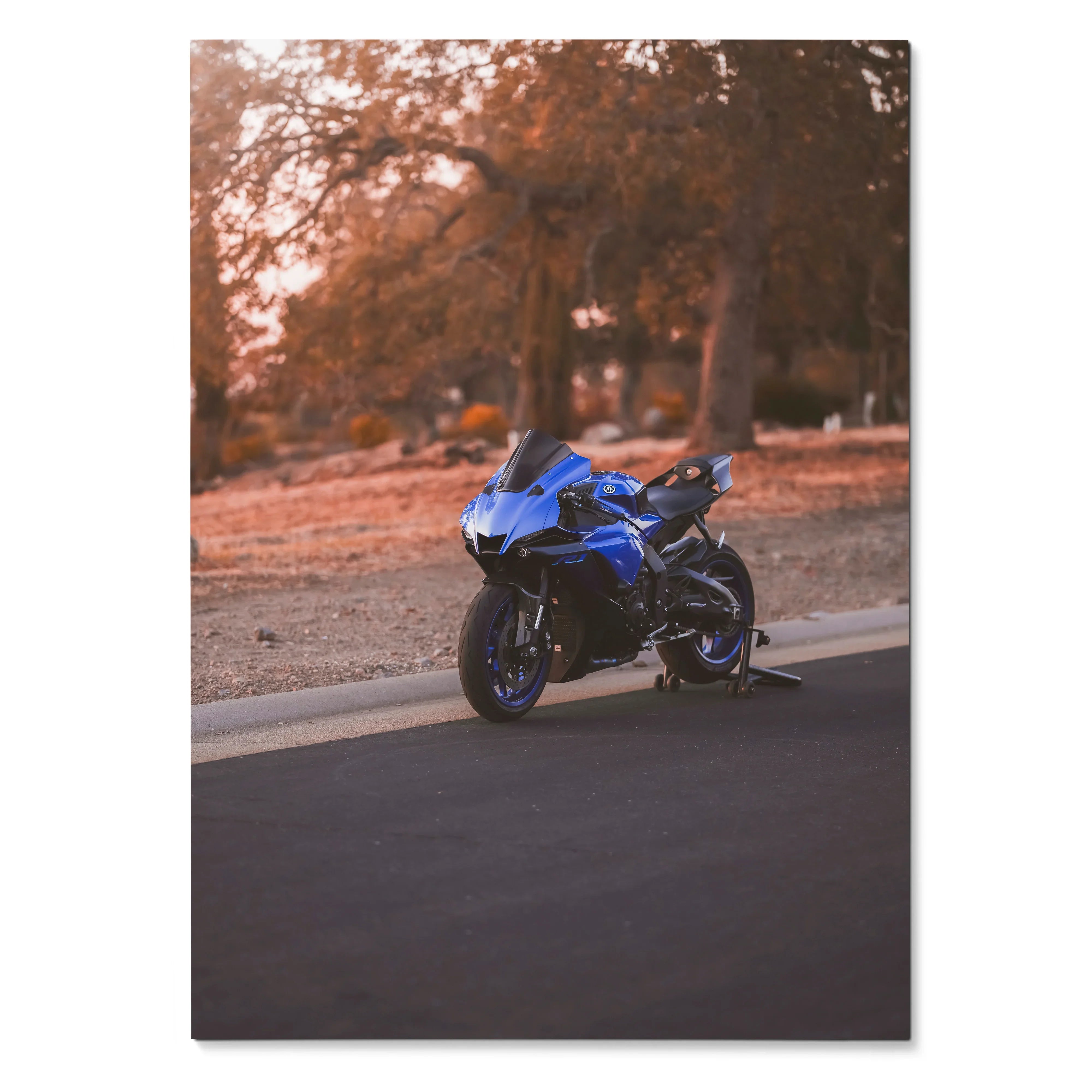 Blue Yamaha R1 motorcycle against autumn trees on road poster wall art.