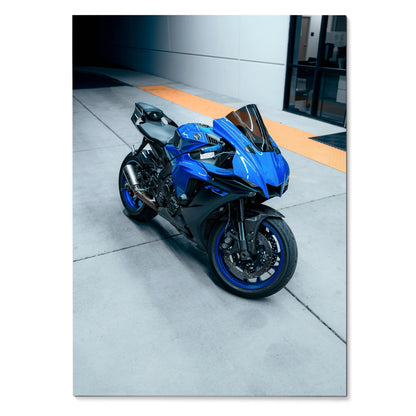 Blue Yamaha R1 motorcycle on modern urban pavement poster wall art.