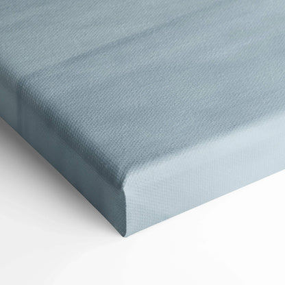 Close-up of light blue textured canvas corner, showcasing museum-quality wall art material and wrap.