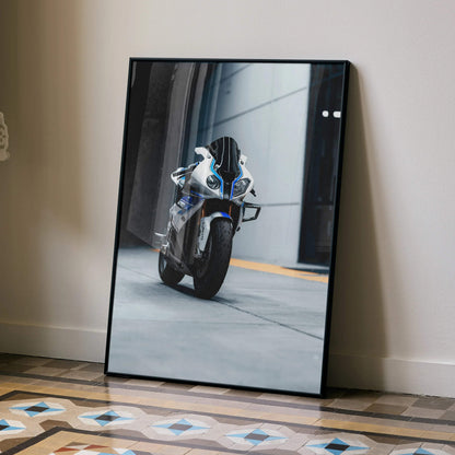 Black-framed canvas print of white and blue bmw s1000rr hp4 motorcycle in motion premium wall decor