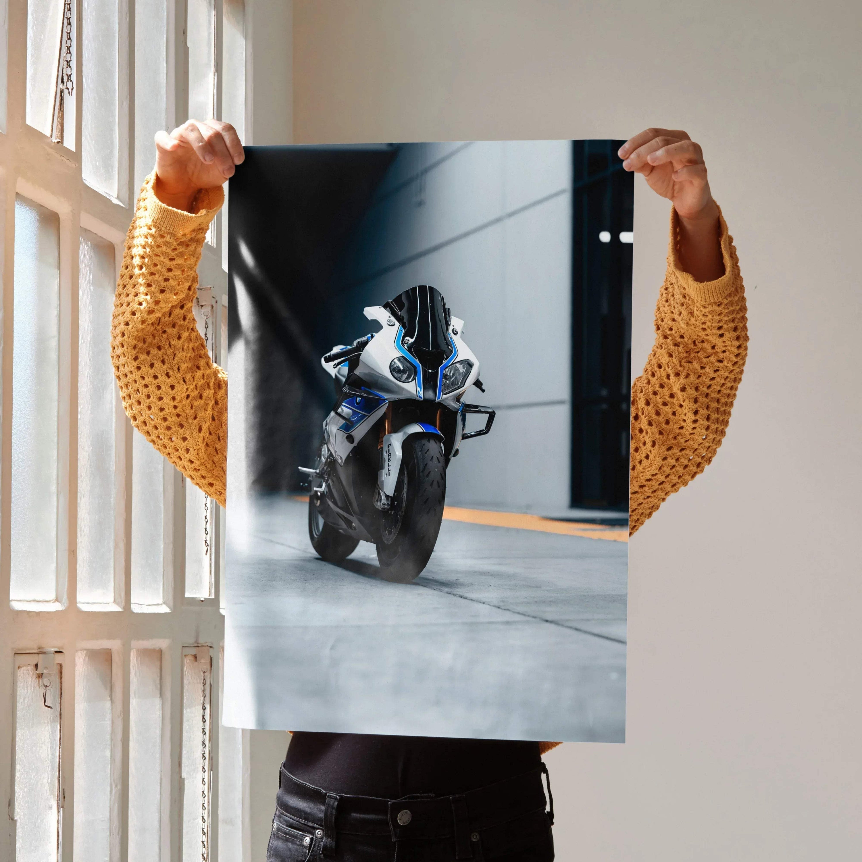 A sleek white and blue BMW S1000RR HP4 motorcycle with black accents in a dynamic urban street pose wall art print