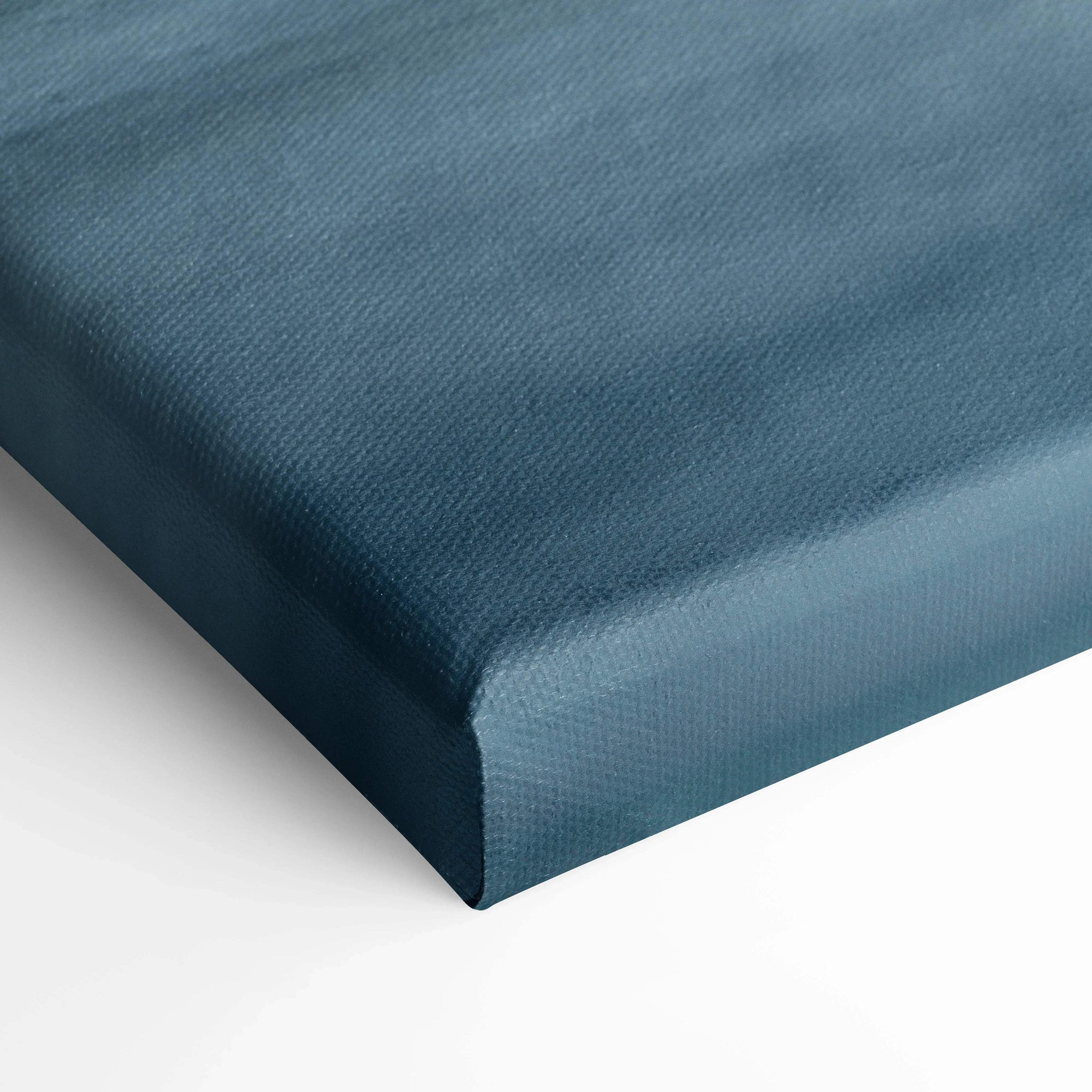 Close-up of textured blue stretched canvas edge for wall art or canvas art print.