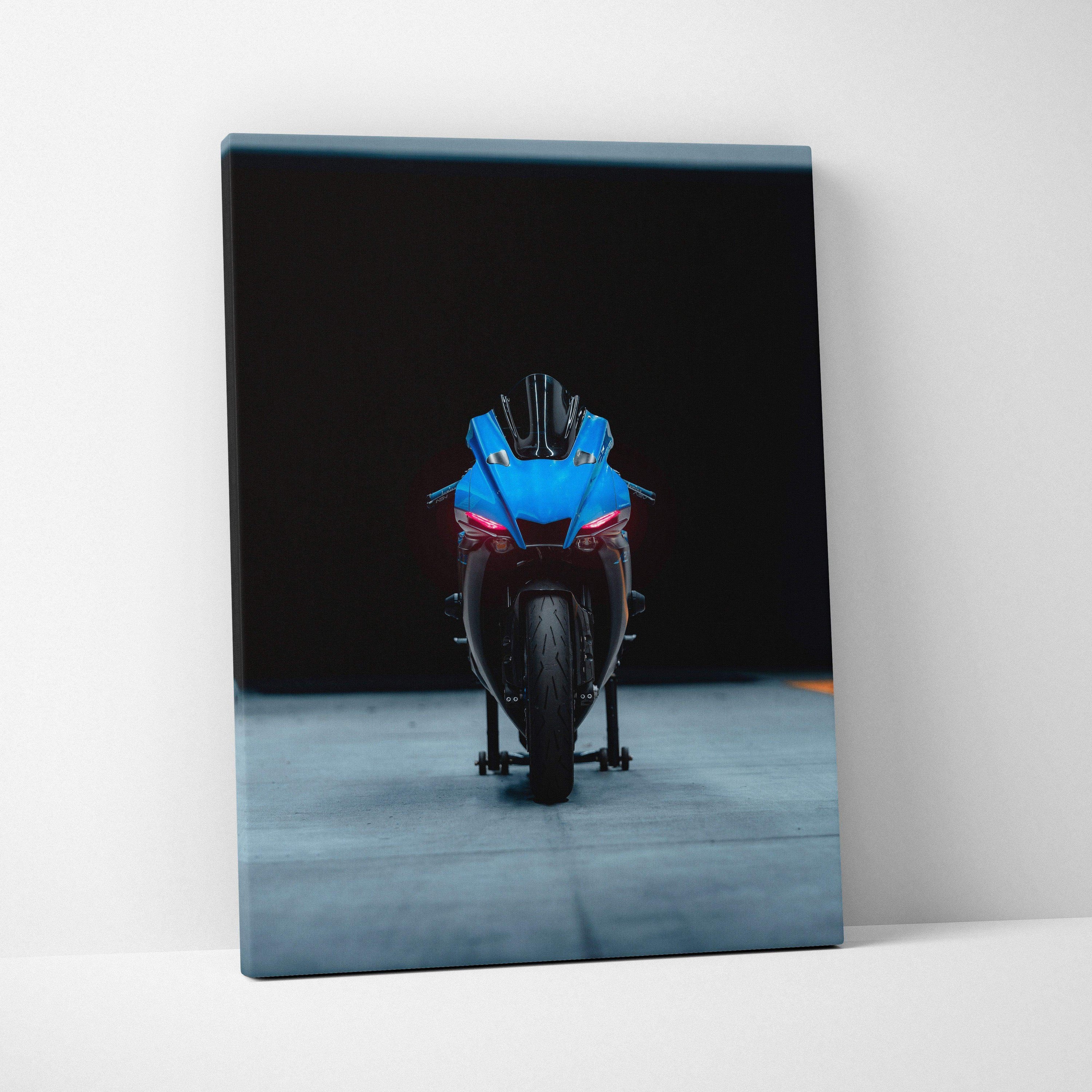 Yamaha R1 motorcycle front view on vertical canvas wall art with black background.