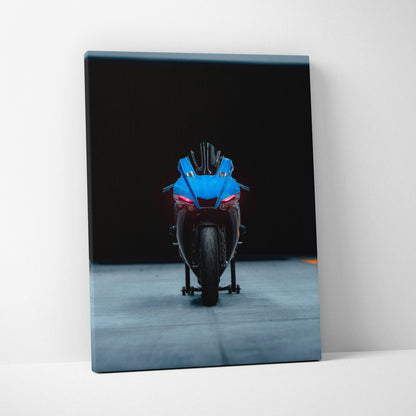 Yamaha R1 motorcycle front view on vertical canvas wall art with black background.