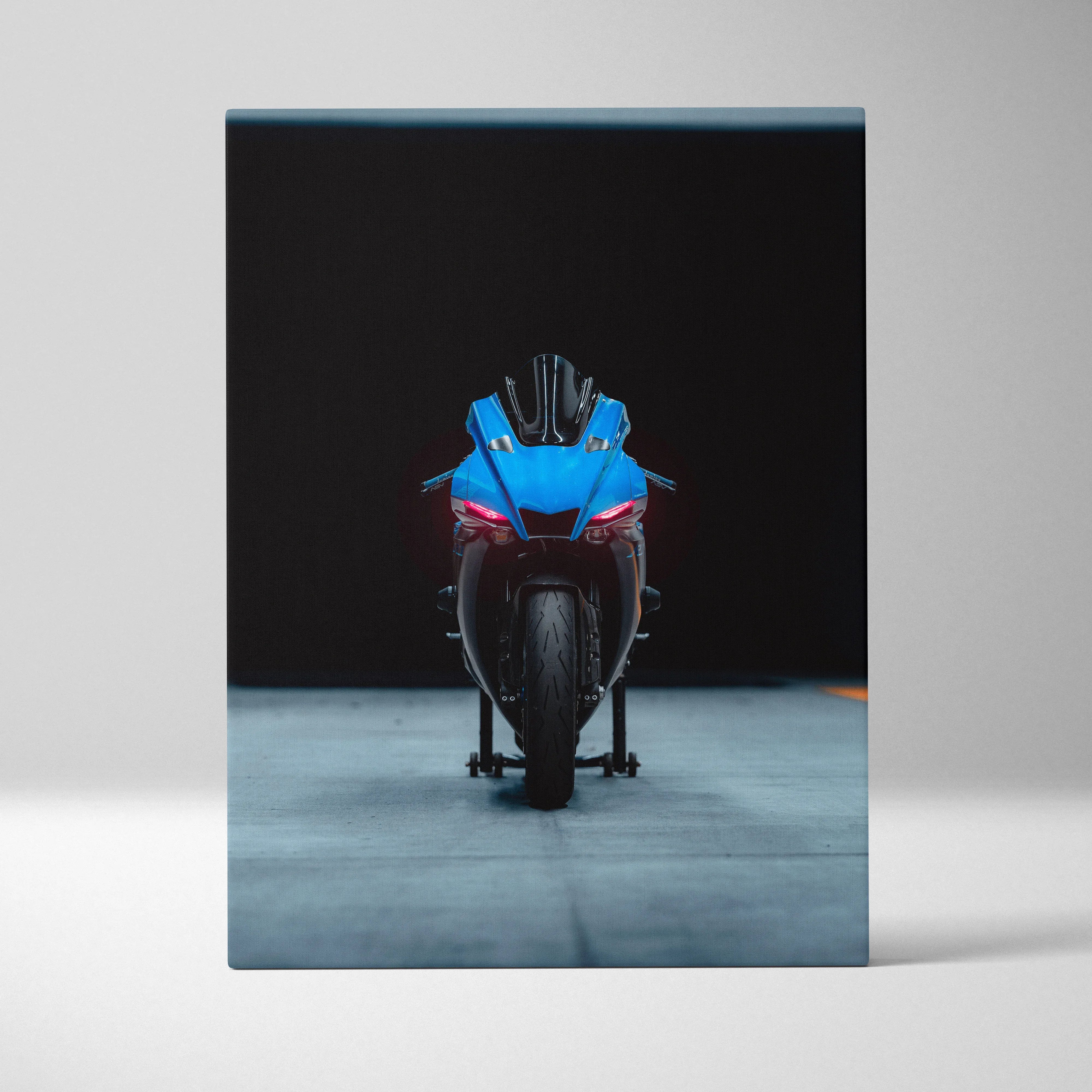 Yamaha R1 blue motorcycle front view on black background canvas wall art.