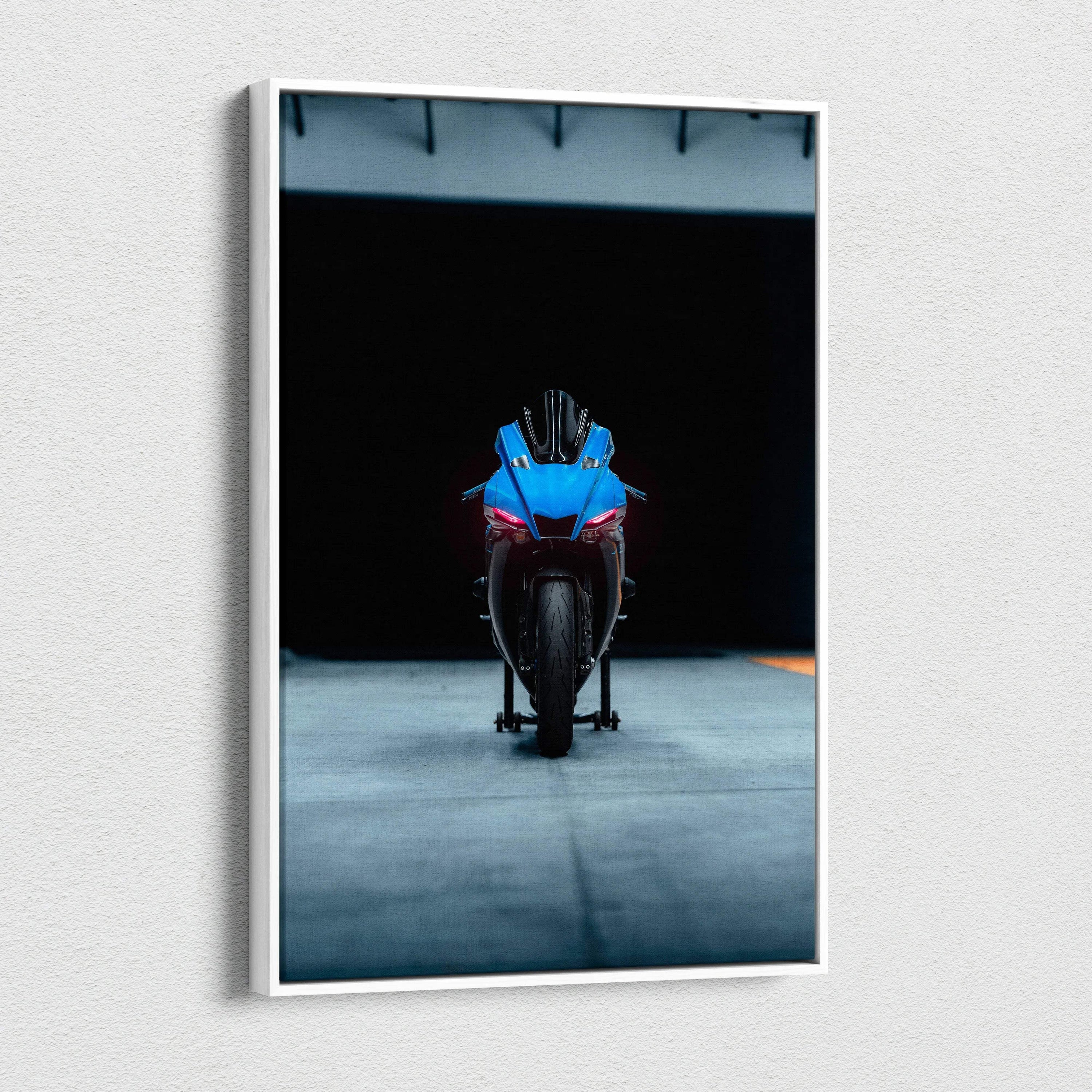 Yamaha R1 motorcycle striking front view on dark background canvas wall art.