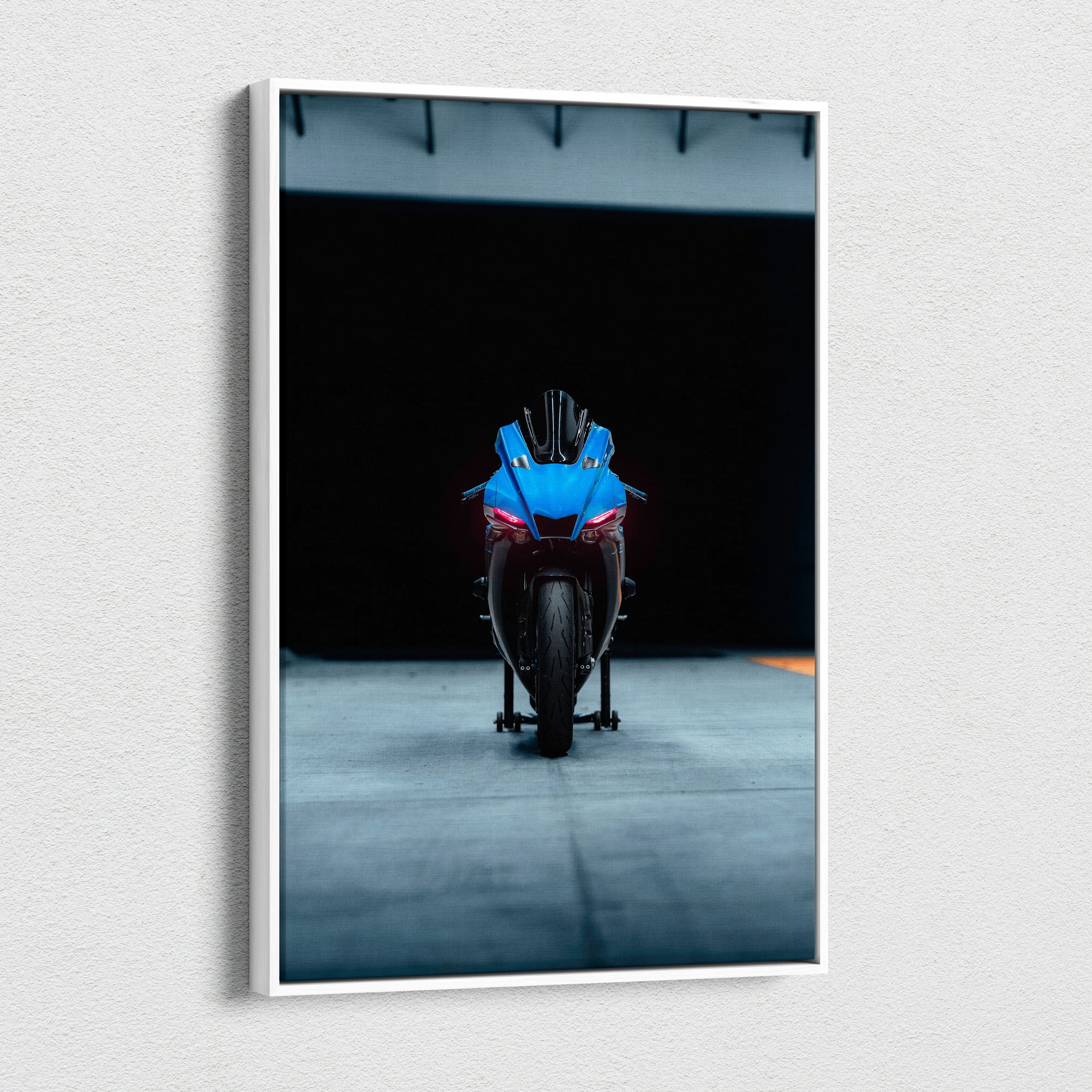 Yamaha R1 motorcycle striking front view on dark background canvas wall art.