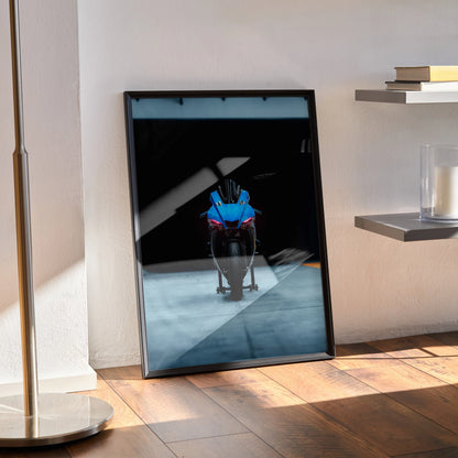 Yamaha R1 motorcycle art print poster leaning against wall with minimalist modern decor, dark background wall art.