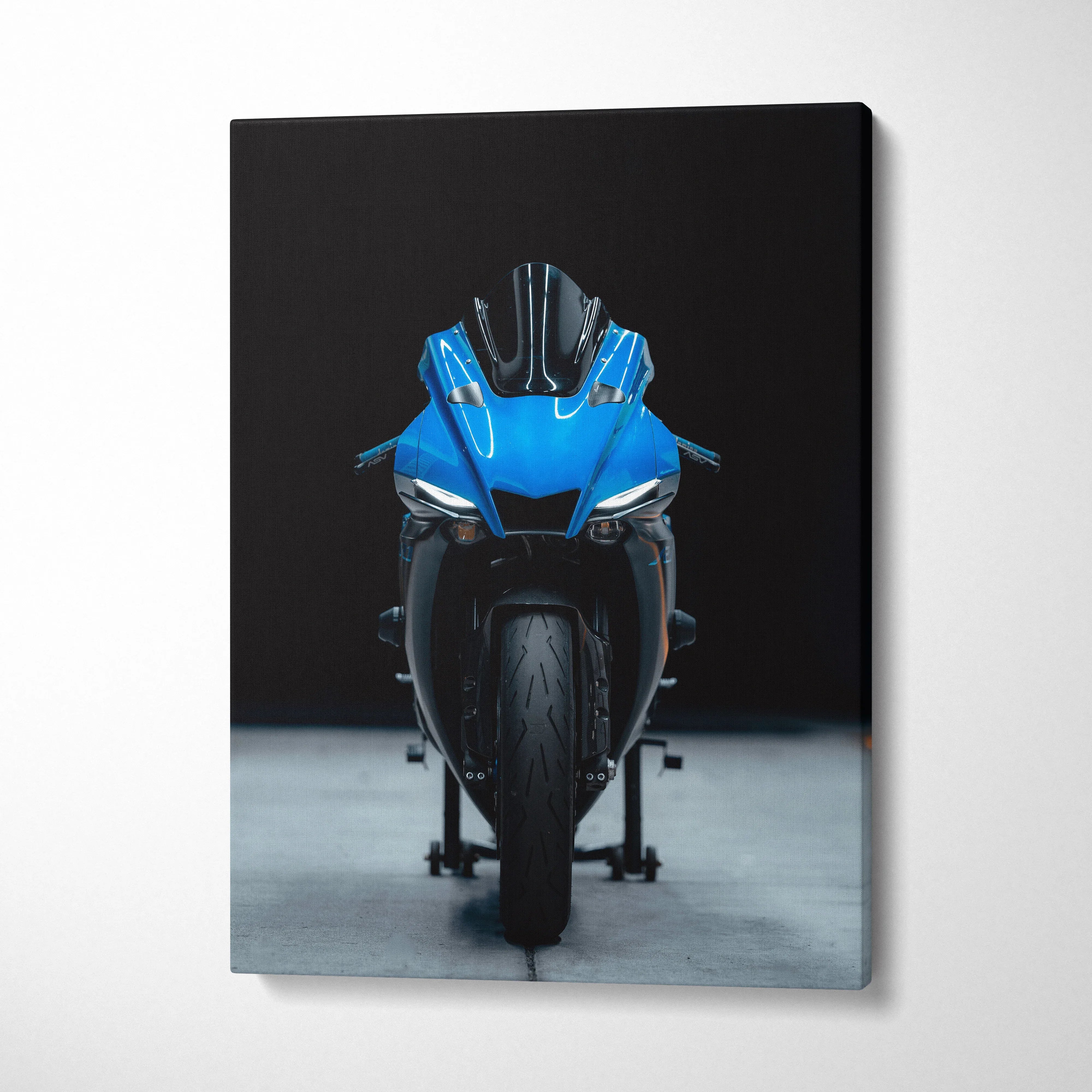 Blue Yamaha R1 motorcycle front view on black background canvas wall art.