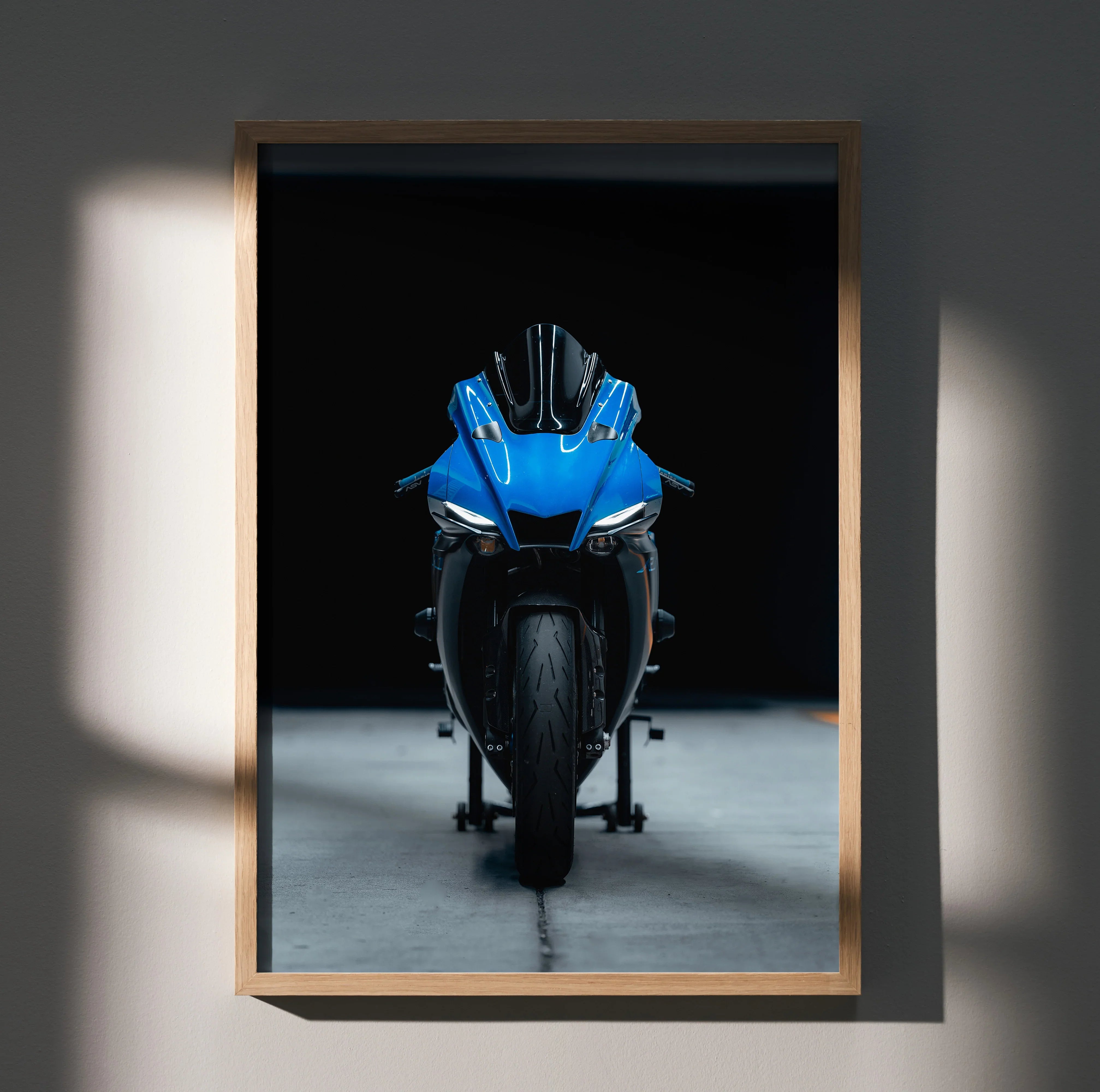 Yamaha R1 motorcycle front view poster with blue bike on black background wall art.