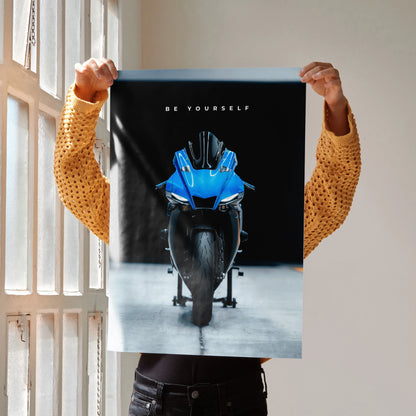 Motivational poster wall art featuring front view of blue Yamaha R1 motorcycle with "Be Yourself" text on black background.
