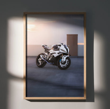 BMW S1000RR motorcycle poster with sunset backdrop, sleek white sportbike wall art in wooden frame.