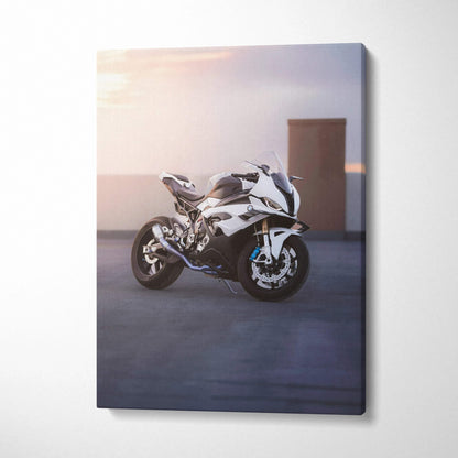 Vertical canvas wall art featuring a sleek white BMW S1000RR motorcycle at sunset with soft lighting.