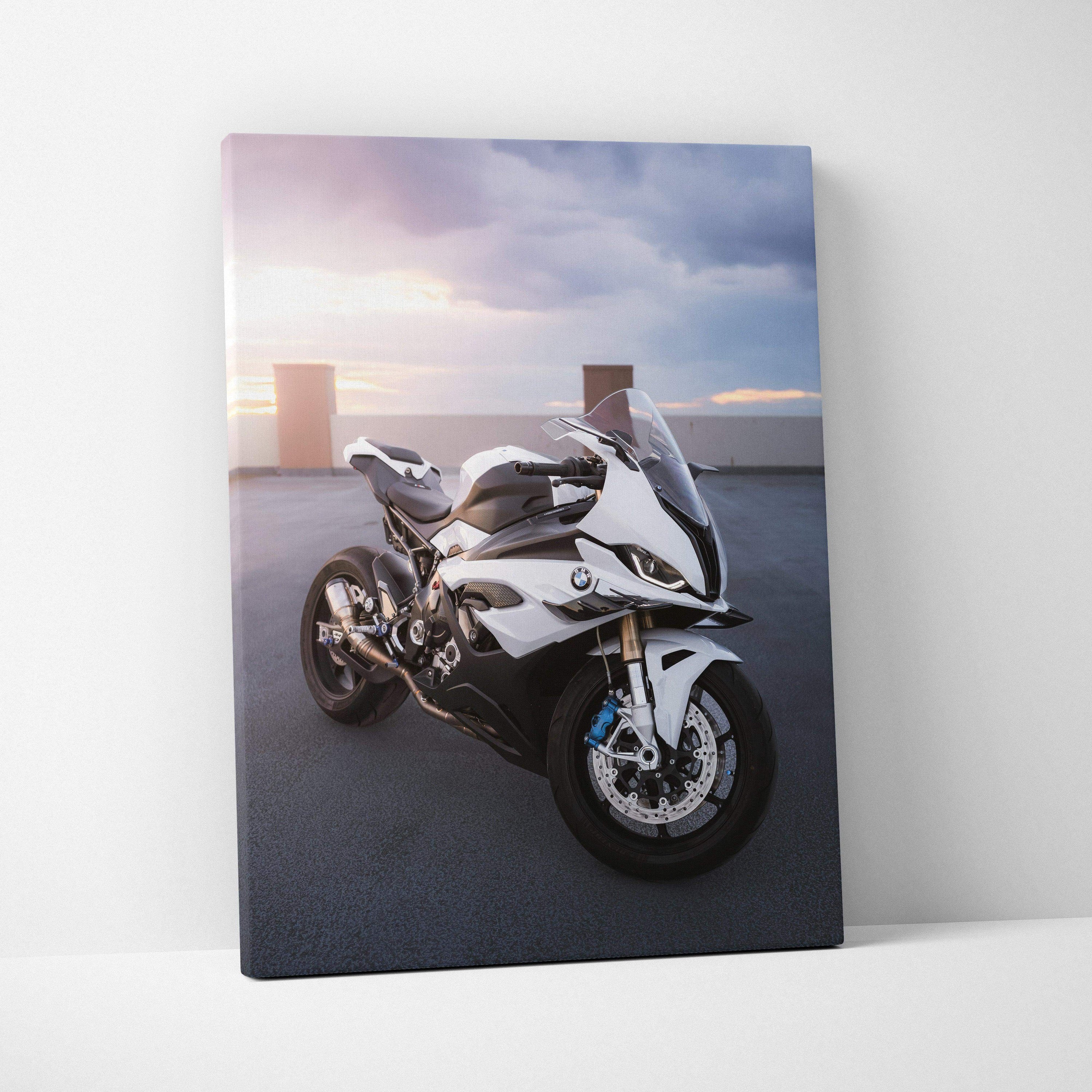 BMW S1000RR motorcycle on asphalt at sunset, sleek white sportbike canvas wall art.