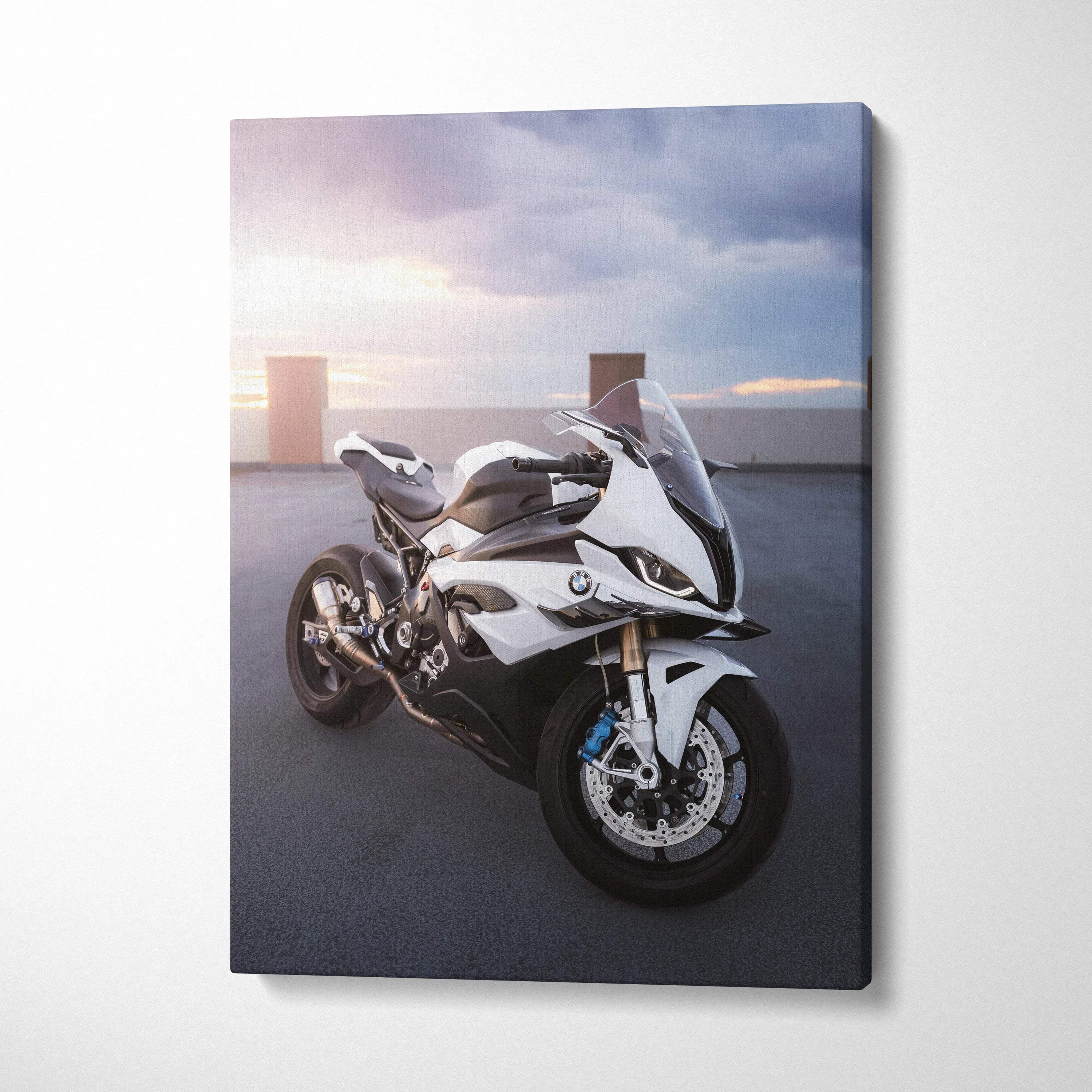 White BMW S1000RR sportbike against a sunset sky on vertical canvas wall art.