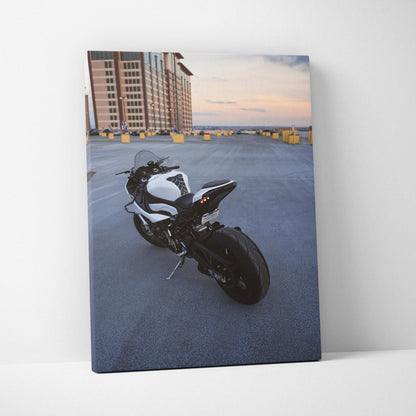 BMW S1000RR motorcycle on rooftop parking at sunset vertical canvas wall art.
