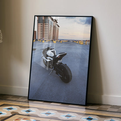BMW S1000RR motorcycle poster with urban cityscape, high-quality satin wall art in black frame.