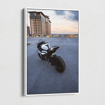BMW S1000RR motorcycle on rooftop at sunset vertical canvas wall art with modern cityscape background.