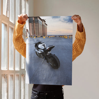 High-quality satin poster of BMW S1000RR motorcycle parked by waterfront at sunset, wall art with sleek black and white bike .