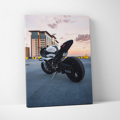 BMW S1000RR motorcycle at sunset on vertical canvas wall art with urban background.