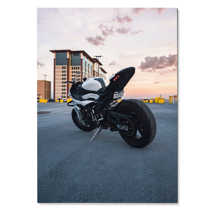 BMW S1000RR motorcycle poster with sunset sky background, urban rooftop wall art.