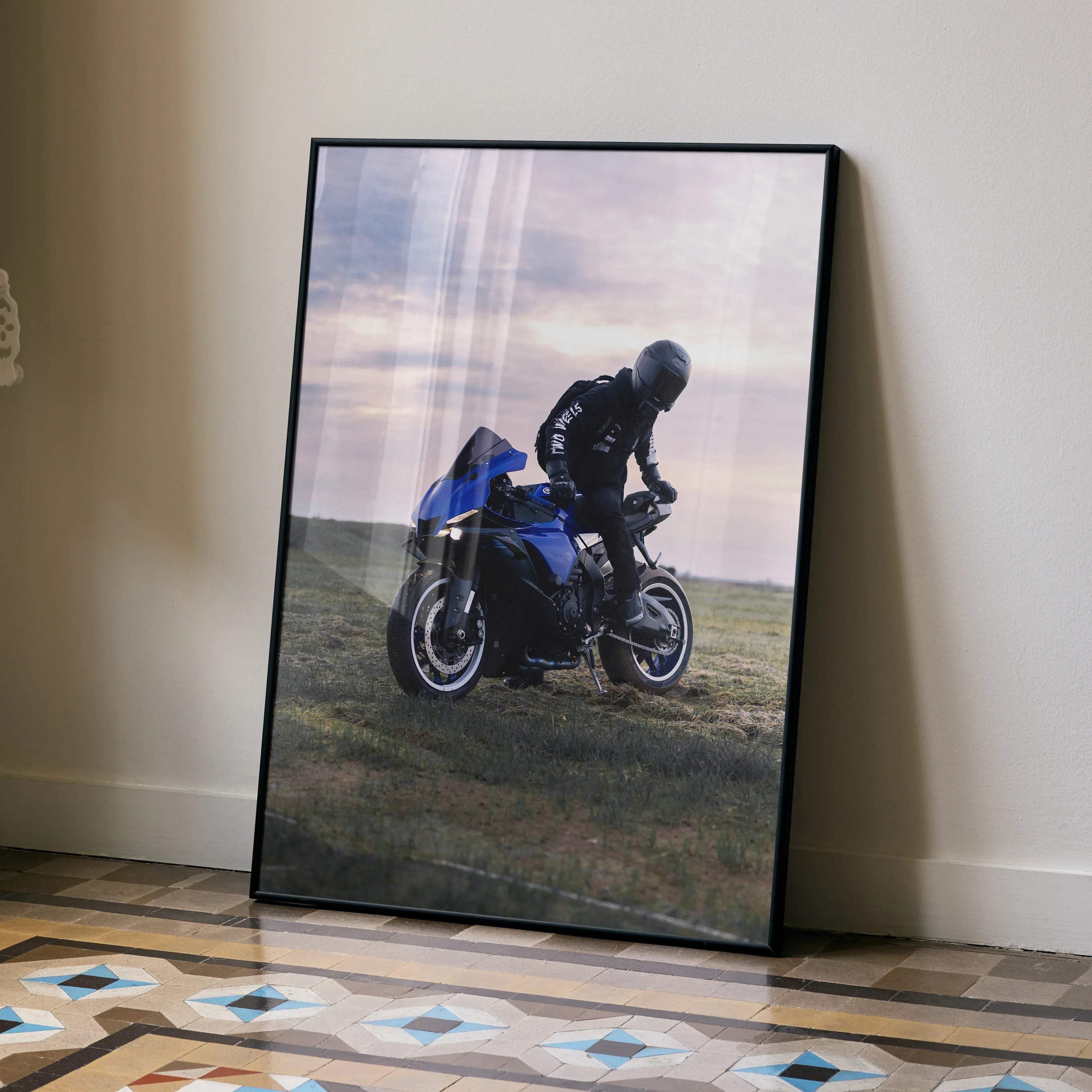 Black-framed poster featuring a blue and black Yamaha R1 motorcycle with rider in Bell Race Star DLX Flex helmet leaning into a turn