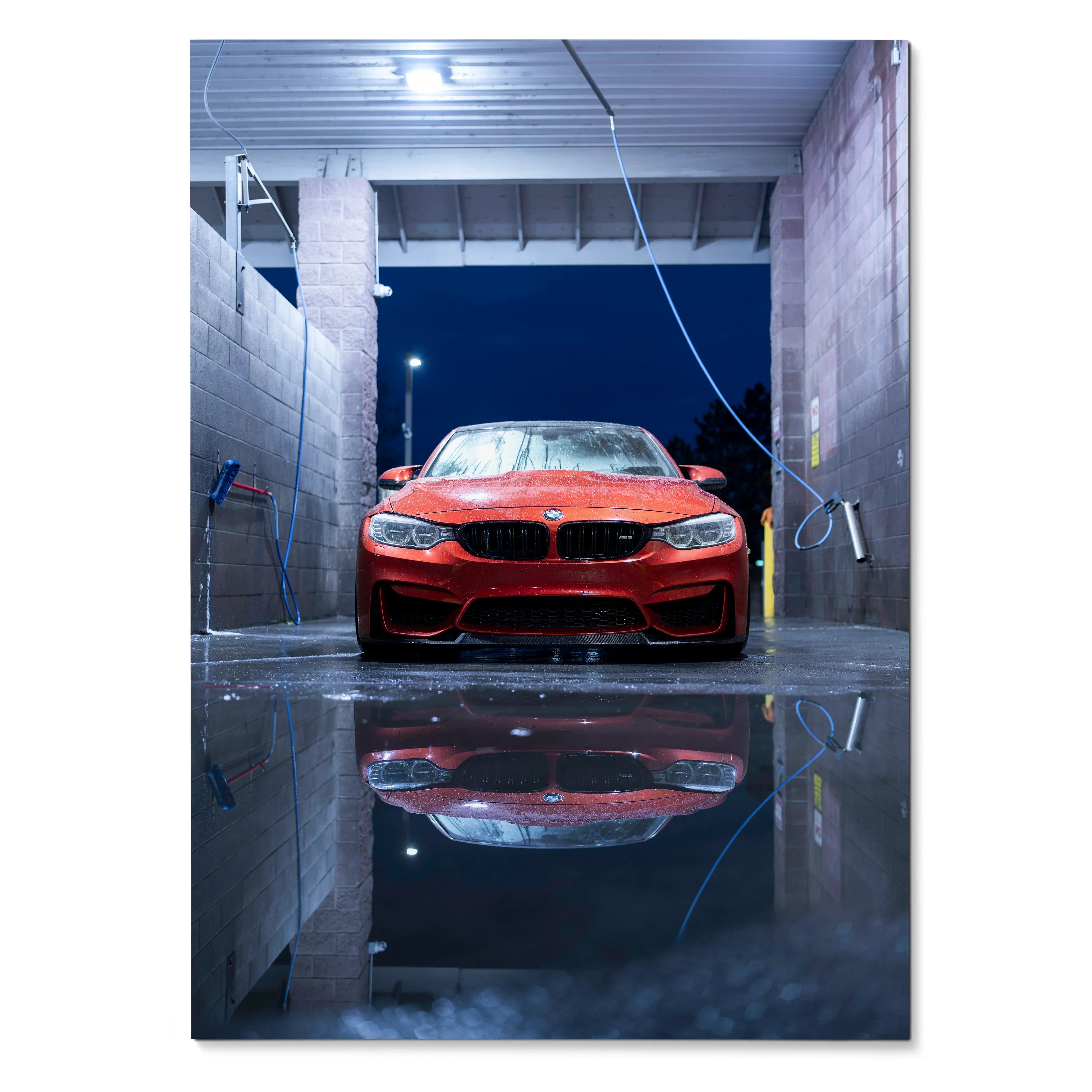 Red BMW F80 M3 reflected in water at night Poster wall art with urban wash bay background.