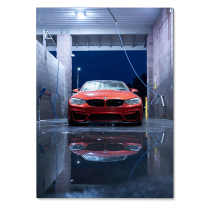 Red BMW F80 M3 reflected in water at night Poster wall art with urban wash bay background.