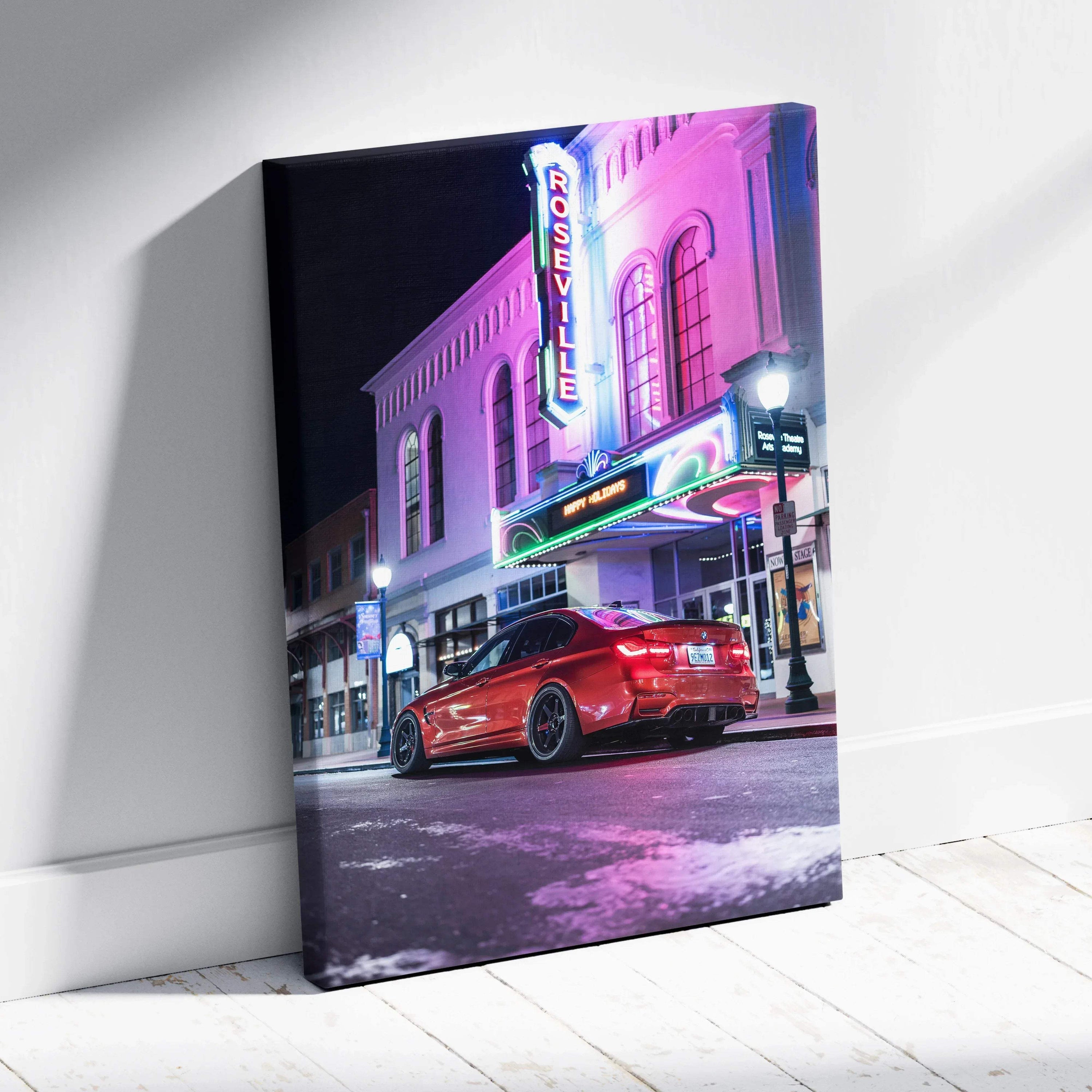BMW F80 M3 red sports car parked in front of neon-lit theater at night on vertical canvas wall art.