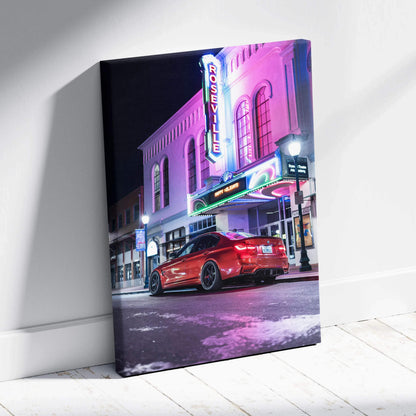 BMW F80 M3 red sports car parked in front of neon-lit theater at night on vertical canvas wall art.